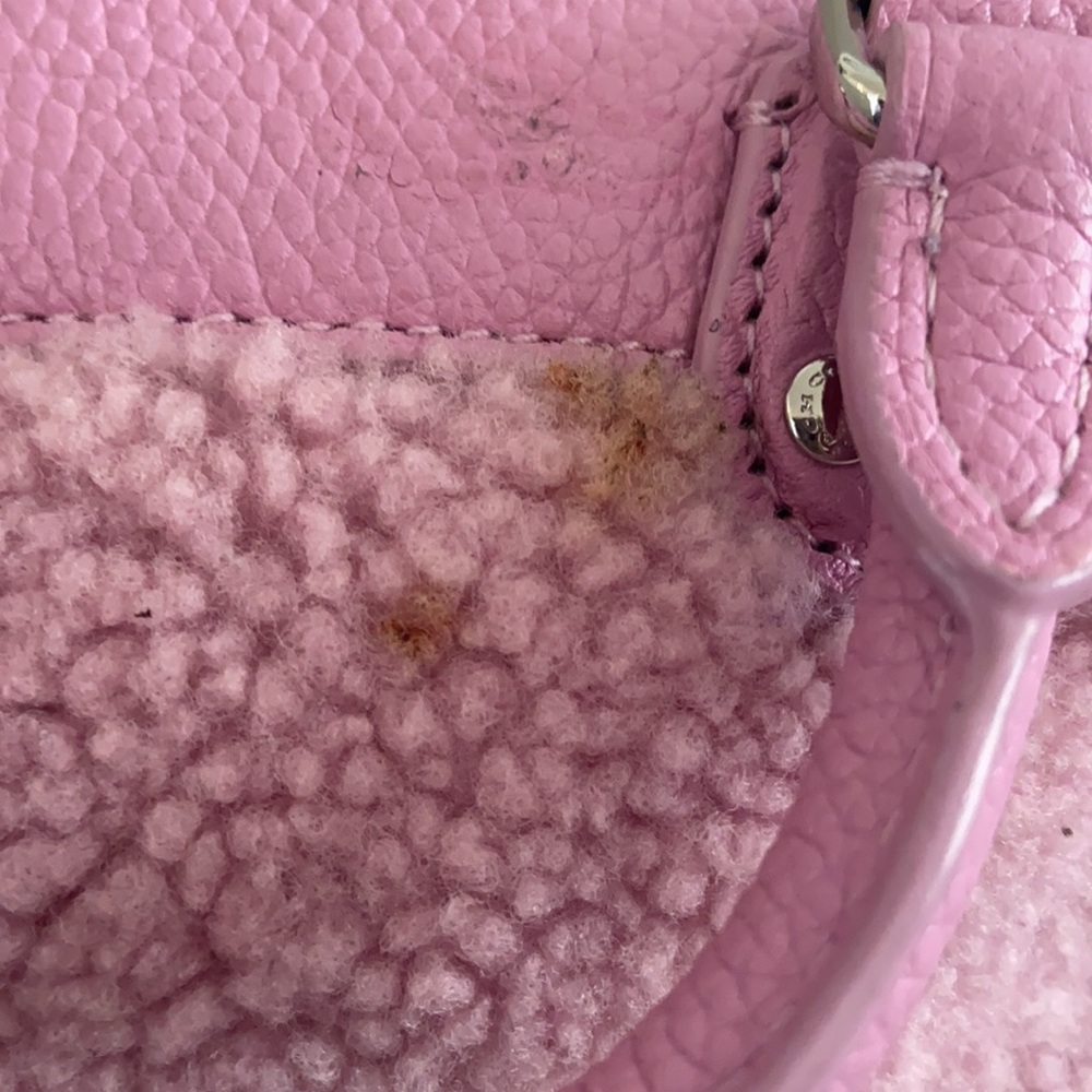 Small pink fuzzy coach crossover asking $75.00